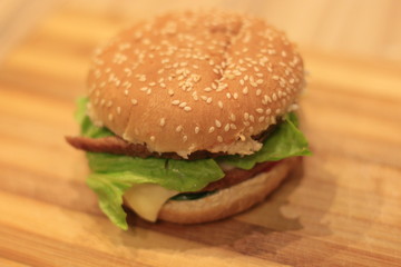 hamburger lying on a wooden table