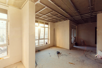 Unfinished building interior white room repairs in the apartment preparing in the room