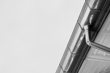 zinc rain gutter at the roof - monochrome