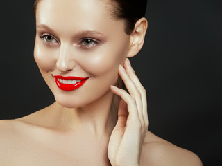 Beauty Fashion Model Woman face. Portrait with perfect skin. Red Lips. Beautiful Sexy Brunette Woman with Luxury Makeup