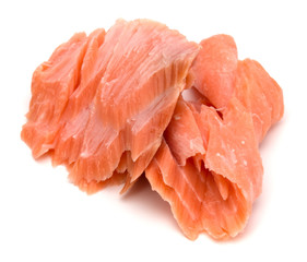 smoked salmon segments isolated on white background cutout. Prepared fish fillet fibres.