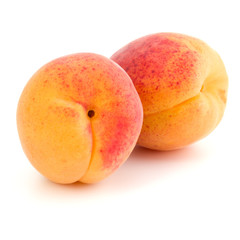 Two apricot fruit isolated on white background cutout