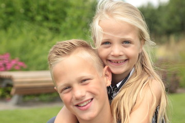 Brother and sister outside