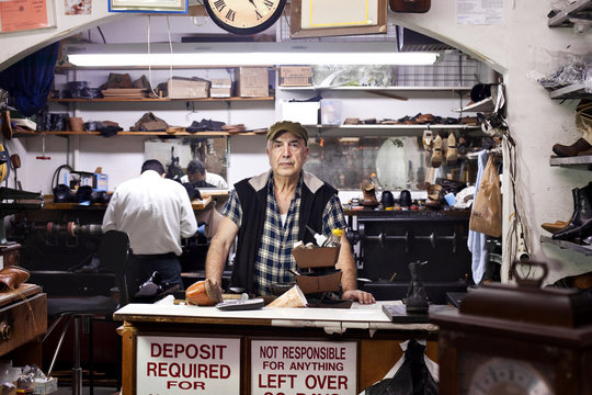 Shoemakers in workshop
