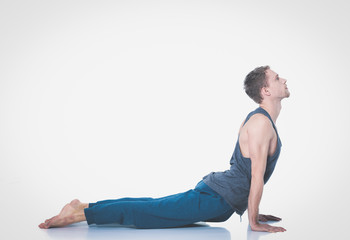 Fototapeta na wymiar Young man practicing yoga. Yoga. Yoga Instructor