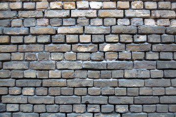 old wall of gray brick
