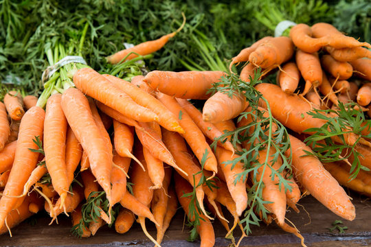 Crop of organically grown carrots on display at farmers market
