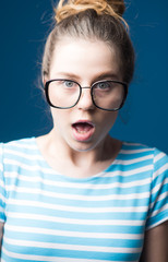 visual improvement. visual improvement of surprised teen girl in glasses. woman in glasses makes visual improvement. visual improvement clinic. now i can see you well