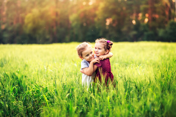 Fototapeta premium two little girls hug, friendship 