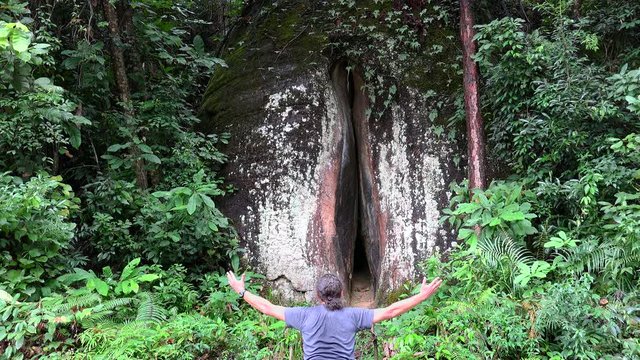 Guy is greeting the Yin Yuan Stone  in the Mount Danxia geopark. Guangdong, China