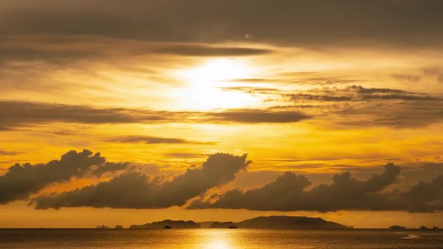 Time lapse twilight sky and cloudy evening at island beach, ranong, thailand.