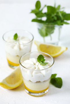 Limoncello - italian Dessert.  Lemon Cheesecake Mousse with Whipped Cream in cups.