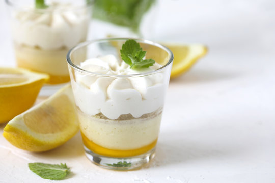 Limoncello - italian Dessert.  Lemon Cheesecake Mousse with Whipped Cream in cups.
