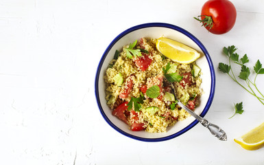Lemon couscous. Couscous with tomato, cucamber, lemon and herbs. Traditional Arabic Salad Tabbouleh