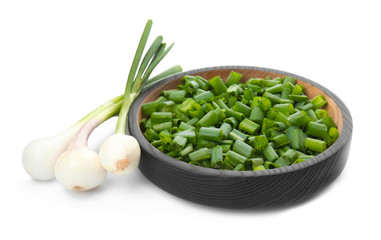 Bowl with chopped green onion and stems on white background