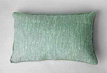 Soft decorative pillow on light background