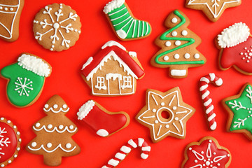 Tasty homemade Christmas cookies on color background, top view