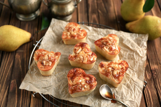 Delicious pastry with pear on table