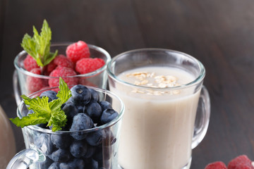 berry smoothie with oatmeal in a glass, healthy eating diet concept