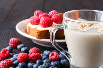 Non-dairy vegan oat milk with berries, healthy diet