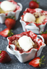 Strawberry crumble with ice cream in bowl,