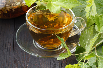 Cups of mint tea on table
