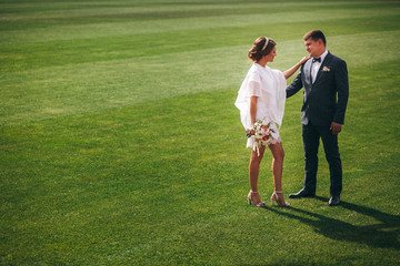 Loving couple.Happy couple.Lovers have fun.Newlyweds on the football field.Happy moments
