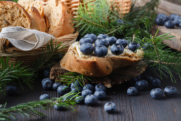 blueberry jam with fresh blueberries and mint. marmalade on spoon and jar