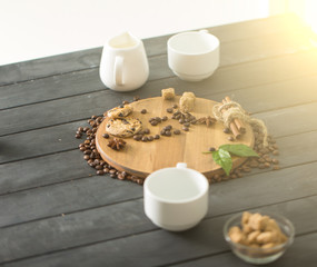 hot black coffee with cookies and beans in cafe