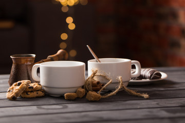 hot black coffee with cookies and beans in cafe