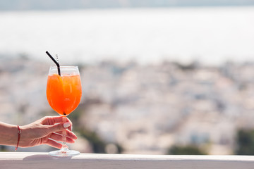 Closeup glass with alcohol drink background in beautiful old Mykonos