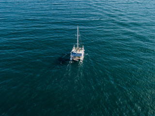 sailing boat catamaran in open sea summer cruise travel concept
