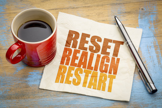 reset, realign, restart concept on napkin