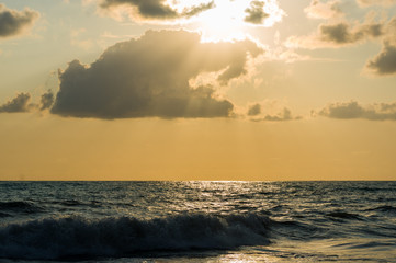 Amazing sea sunset, the sun, waves, clouds