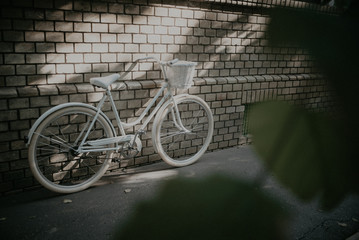 moody picture of hipster woman bike with grunge overlay 