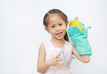 Little Asian child girl hand wear and playing Rhinoceros puppets on white background.