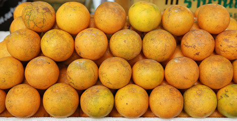 Orange fruit at market.