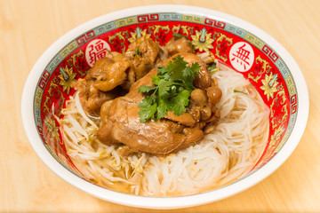 Close up of Steam chicken noodle with soup.