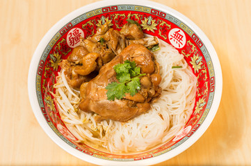 Close up of Steam chicken noodle with soup.