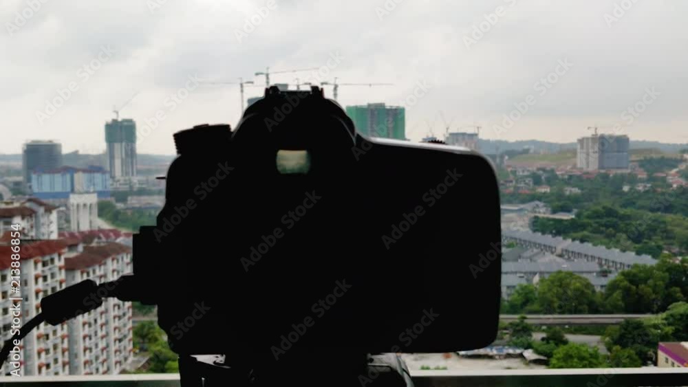 Poster close up of viewfinder: process of shooting timelapse with dslr