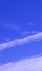 Magnificent white Contrail Cirrus cloud in blue sky. Australia.