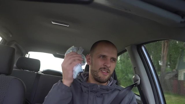 Happy driver with big money euro. Success. Concept on the business success, topic of lottery, winnings, slot machines.