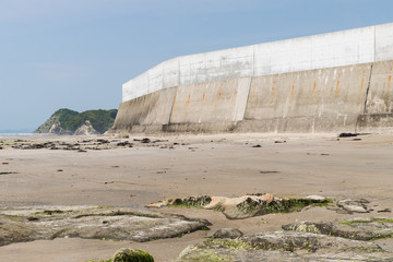 High concrete wall at seaside for protect tsunami big wave