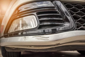 Deurstickers car bumper scratched paint damage © Piman Khrutmuang