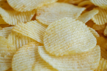 Obraz na płótnie Canvas crispy potato chips snack texture background