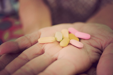 medicine on hand, eat medicine, feeling sick,eating drug, healthcare concept