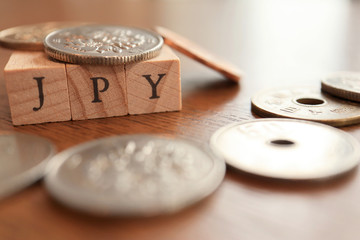 JPY (Japanese Yen) Text Block on Wooden Table