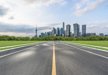 empty asphalt road through the shanghai skyline in China