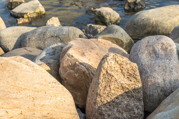 Fototapeta na wymiar river stones In the sun