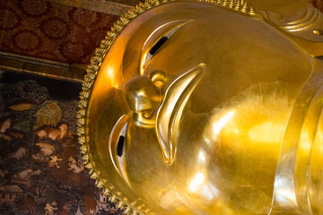 Reclining Buddha monumental figure in Phra Buddhasaiyas temple, Bangkok, Thailand.